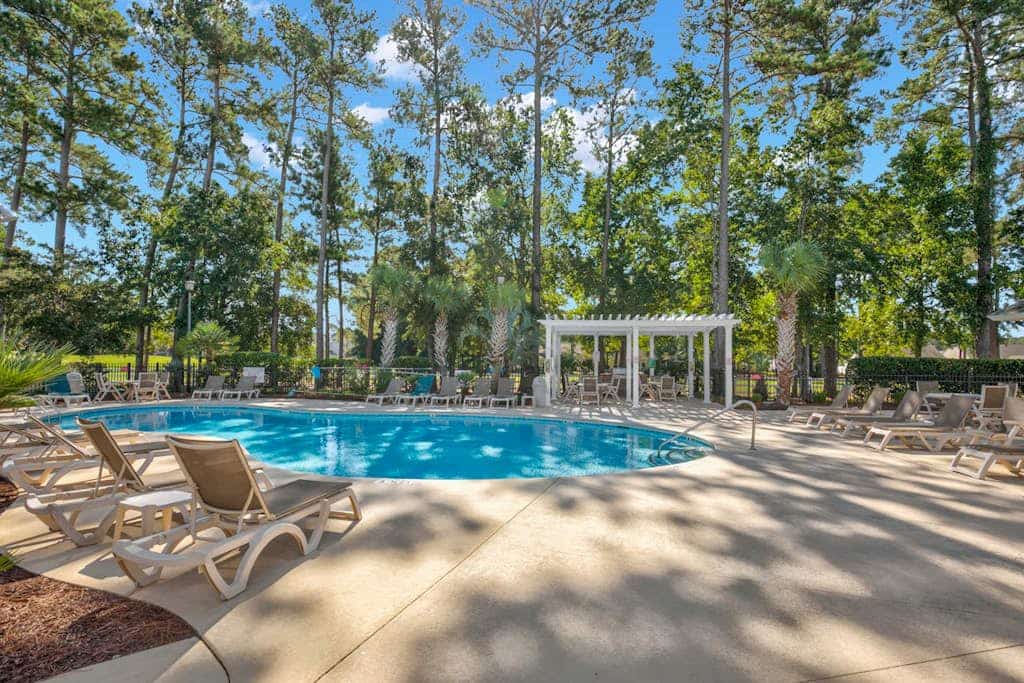 Golf course-front condo with balcony, pool, W/D & lake view - near the beach