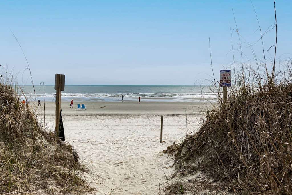 Third-floor beachfront retreat with furnished balcony, pool, washer/dryer