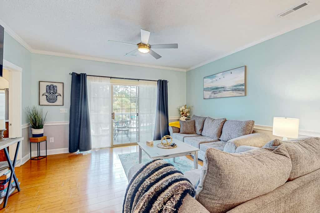 Golf-club adjacent condo with a washer/dryer, elevator, & on-site pool