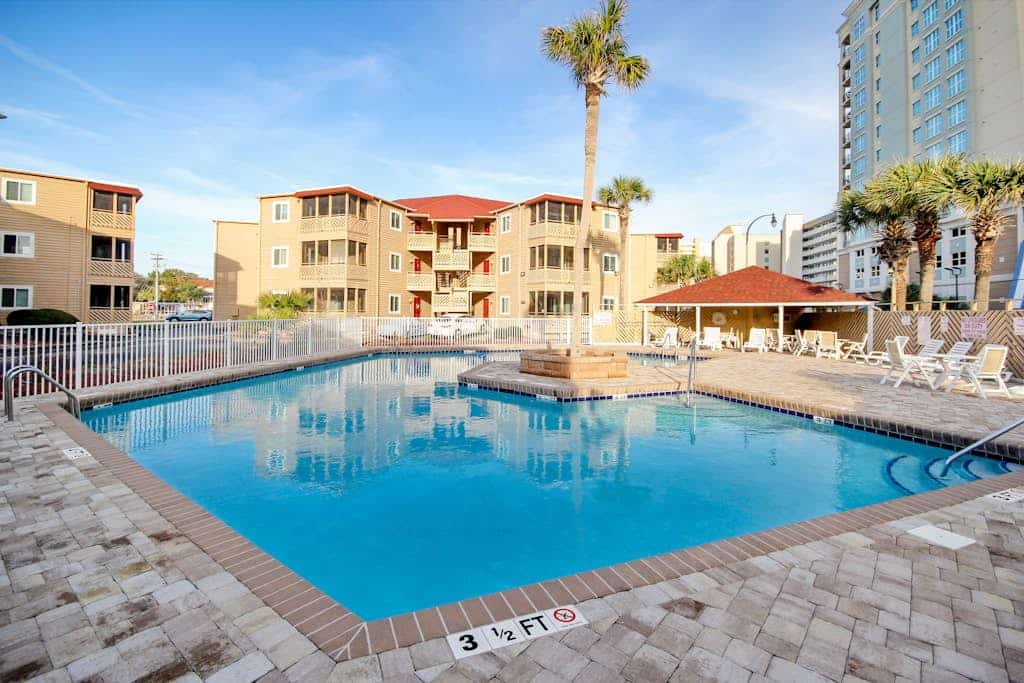 Ocean-view condo, 1 block from beach with enclosed balcony & pool