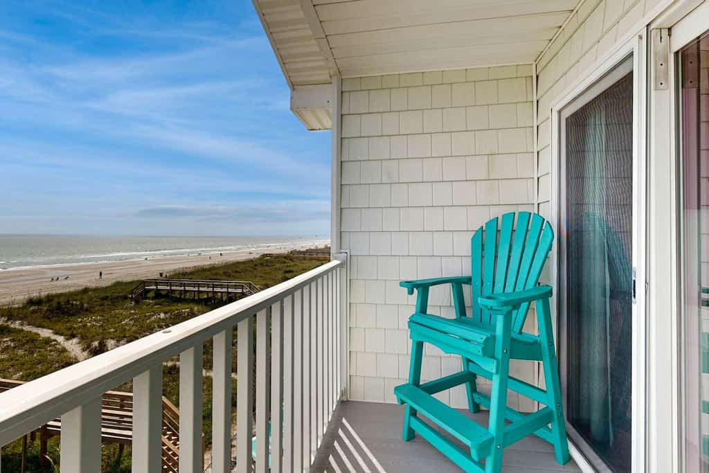 Coastal condo with ocean views, grilling area, and balcony