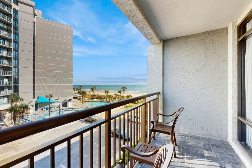 Oceanview studio with pool, private balcony & beach access