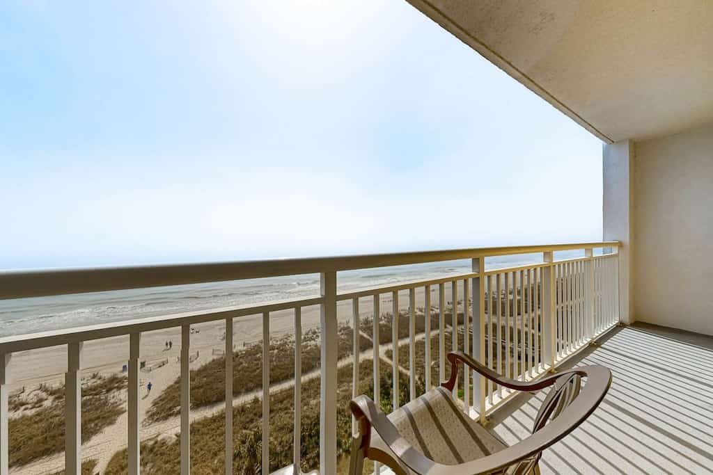 Resort-style beach condo with oceanfront balcony, beach access, hot tubs, pools