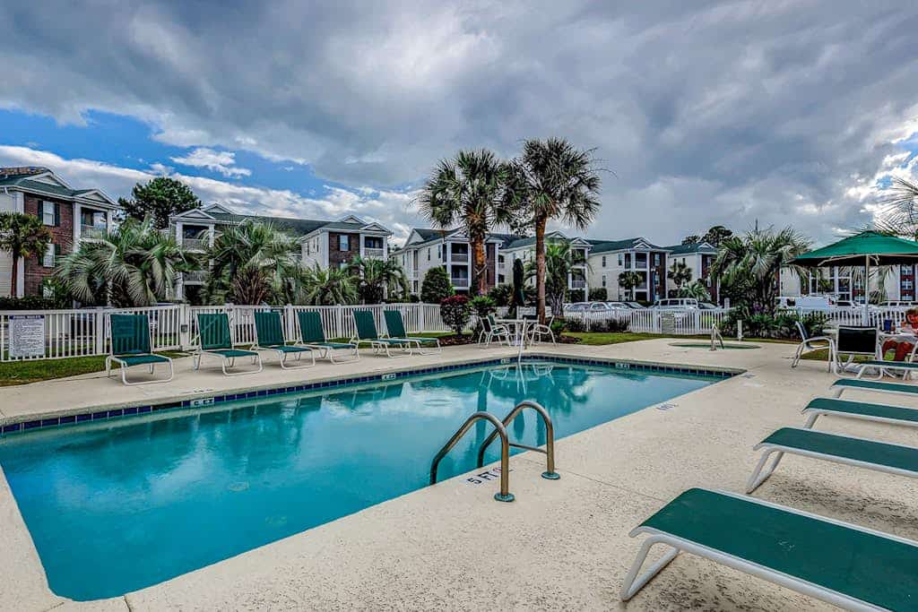 Sunny condo with on-site pool, hot tub, & golf course - balcony, W/D, & AC