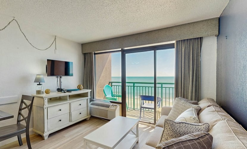 Oceanfront condo with balcony, A/C, & beach access