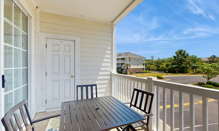 Lovely condo with turquoise pool, balcony, open layout, central AC, & W/D