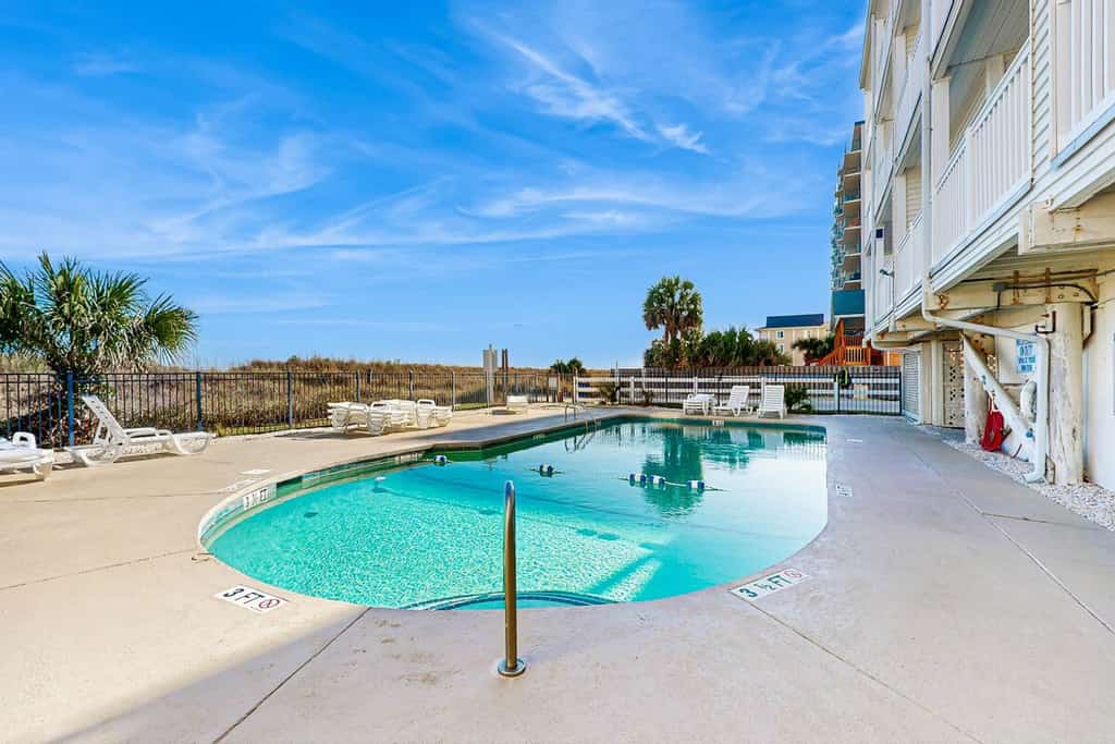 Oceanfront condo with private balcony, pool & direct beach access