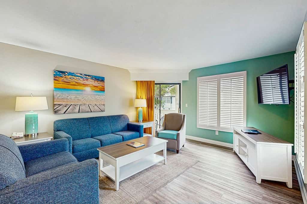 Spacious condo with patio, W/D, pool, hot tub & steps to beach