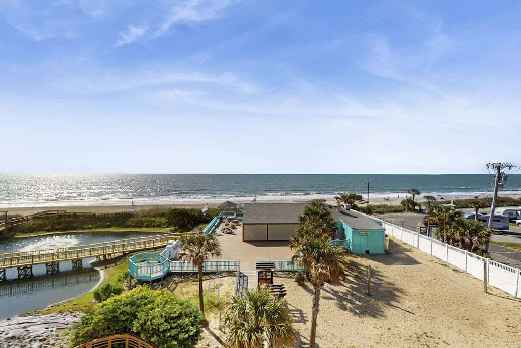 Oceanfront home with shared pools, hot tub, sauna, gym + beach access/free WiFi