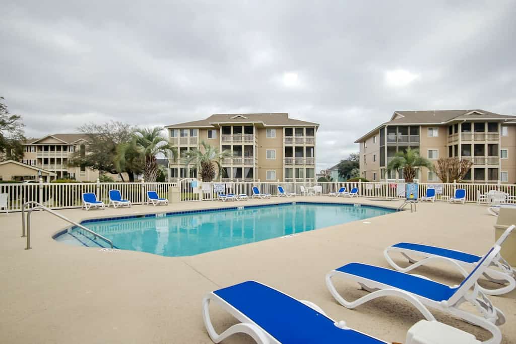 Sunny retreat near the beach with modern updates & AC - hot tub and pool access