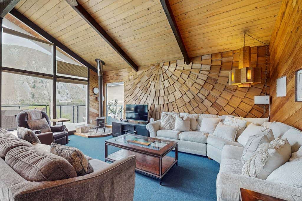 Dog-friendly waterfront home with pool, tennis courts, & large lawn
