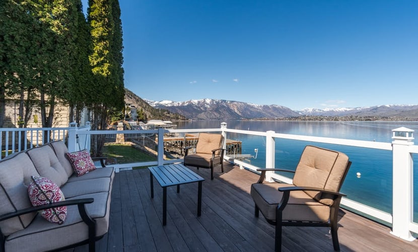 Modern lakefront home with private dock, amazing sunset views, & chef's kitchen