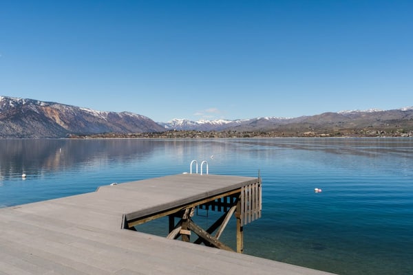 Modern lakefront home with private dock, amazing sunset views, & chef's kitchen