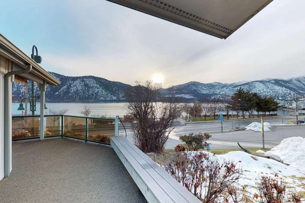 Lakeview home with wrap-around deck, easy lake access, private hot tub, & more