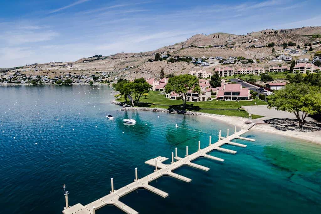 Lake and pool-view condo with beach access, 5 pools, hot tub, & balcony