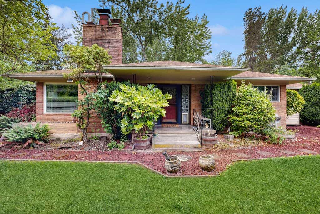 Dog-friendly home on half acre with creek access, game room & 2 fireplaces