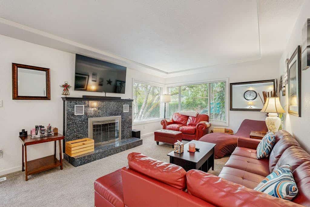 Dog-friendly home on half acre with creek access, game room & 2 fireplaces
