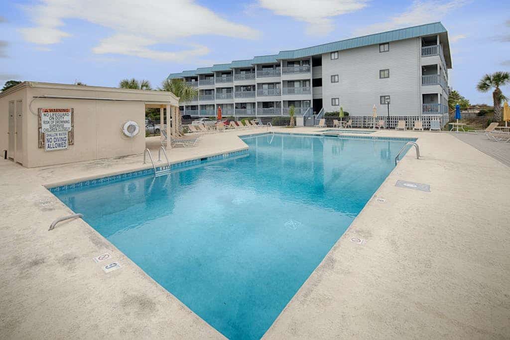 Waterfront island getaway with balcony, pool, tennis, & easy beach access
