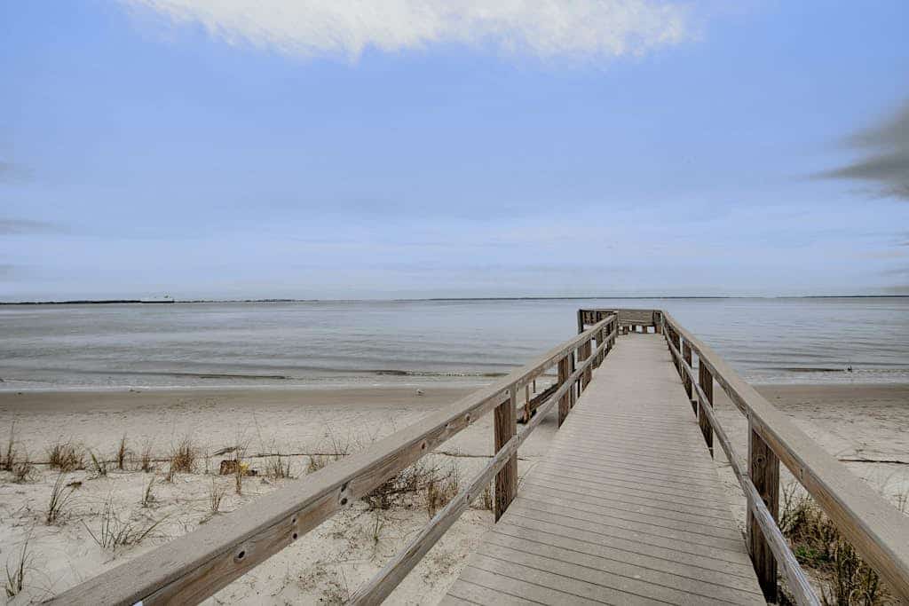 Waterfront island getaway with balcony, pool, tennis, & easy beach access