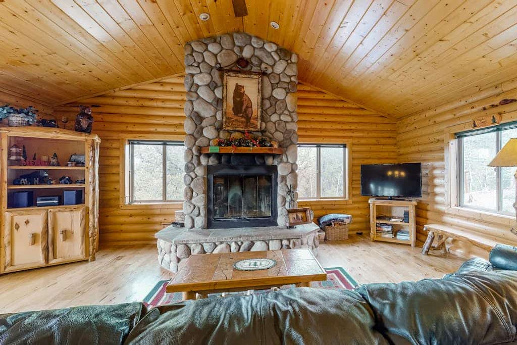 Escape to Bear Crossing, a charming 3-bedroom cabin in Divide, Colorado, perfectly situated for mountain adventures. This pet-friendly retreat features stunning valley views, a private hot tub, and a cozy wood-burning fireplace. Enjoy fully equipped kitchen meals, arcade games, and outdoor firepit nights. Located near Pikes Peak, Mueller State Park, and Cripple Creek casinos, it offers the ultimate year-round getaway for families and outdoor enthusiasts seeking comfort and natural beauty in the heart of the Rockies.