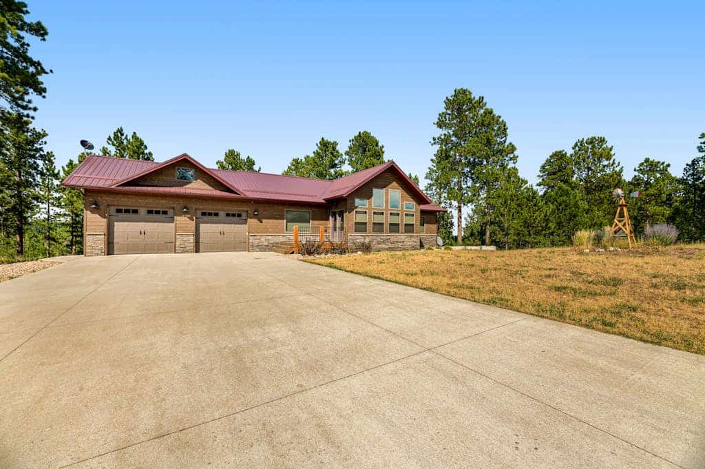 Come enjoy the ultimate Black Hills getaway at Klassy Lodge, our beautiful five bedroom home in Sturgis. This stylish retreat features a private hot tub, a fun game room, and breathtaking views of Pillar Peak. Perfectly situated near National Forest trails, Deadwood casinos, and Mount Rushmore, our lodge is the ideal base for families and groups. Enjoy modern amenities like a gourmet kitchen, cozy fireplaces, and an outdoor fire pit for unforgettable evenings under the stars in the heart of South Dakota.