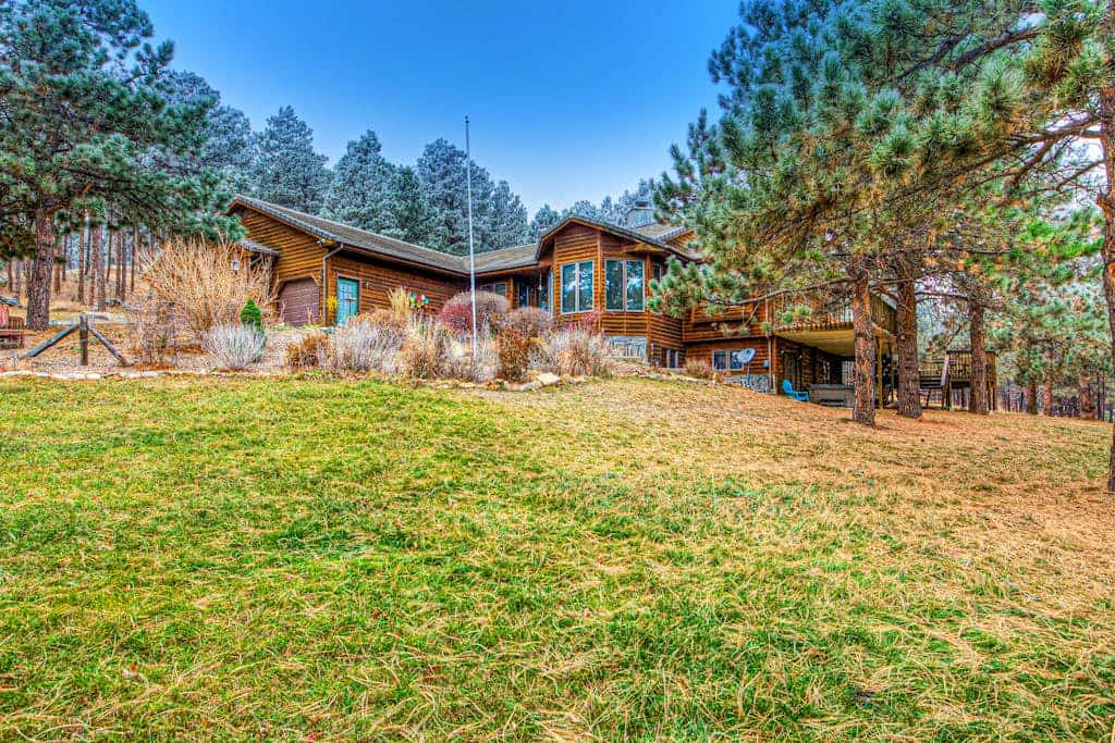 Come experience Crooked Canyon Lodge, a lovely four bedroom retreat tucked away on twenty private acres near Rapid City. This home is perfect for families and pets, featuring wonderful amenities like a hot tub, sauna, and sand volleyball court. You will love the convenience of two full kitchens and spacious living areas, all while staying just minutes from landmarks like Mount Rushmore and Sturgis. It is the perfect spot to enjoy peaceful mountain surroundings while staying close to all the fun in South Dakota.