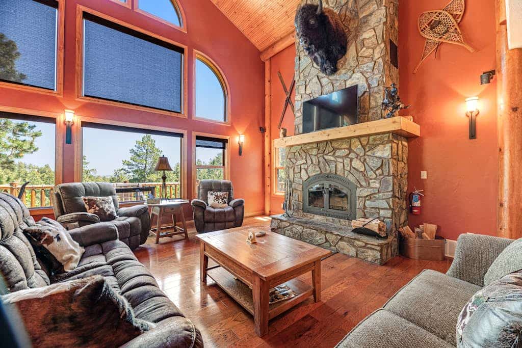 Escape to Ridgeview Retreat, a stunning 4-bedroom Black Hills cabin offering the perfect blend of luxury and nature. Located just three miles from Deadwood, this spacious 3-story home features a private hot tub, a cozy wood-burning fireplace, and sweeping forested views. Whether you are exploring nearby Mount Rushmore or relaxing on the deck, this family-friendly basecamp provides central air, a gourmet kitchen, and easy access to local attractions. Experience ultimate comfort in the heart of the mountains.