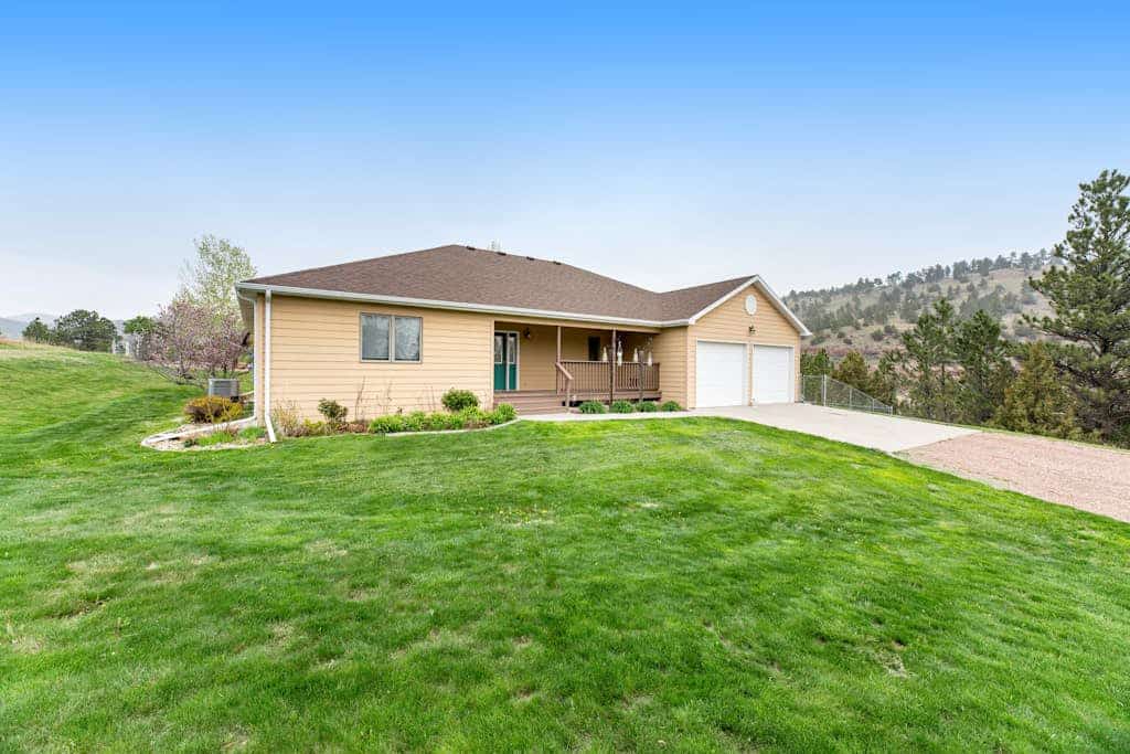 Escape to this spacious four bedroom ranch in Hot Springs South Dakota. Perfectly situated for your Black Hills adventure, this retreat features vaulted ceilings, a full kitchen, and a relaxing porch. Enjoy modern comforts including air conditioning, internet, and laundry. You are minutes from top attractions like Wind Cave National Park, the Mammoth Site, and Evans Plunge. Ideal for families and friends seeking a comfortable base near the southern Black Hills.