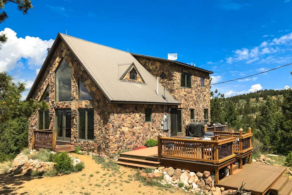 Escape to Peak View Vista, a secluded 3-bedroom mountain cabin in Florissant, Colorado. Perched on five private acres, this retreat offers breathtaking 360-degree views of Pikes Peak and stunning sunrise vistas. Perfect for families, our home features an inviting family room, a fun-filled kids room, and a wet bar. Located minutes from the Florissant Fossil Beds and Eleven Mile State Park, it is the ultimate base for fly fishing, hiking, and exploring the Colorado Wolf and Wildlife Center in total comfort.