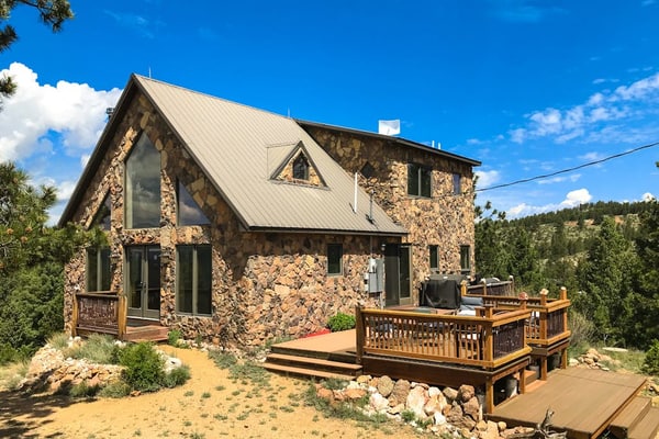 Escape to Peak View Vista, a secluded 3-bedroom mountain cabin in Florissant, Colorado. Perched on five private acres, this retreat offers breathtaking 360-degree views of Pikes Peak and stunning sunrise vistas. Perfect for families, our home features an inviting family room, a fun-filled kids room, and a wet bar. Located minutes from the Florissant Fossil Beds and Eleven Mile State Park, it is the ultimate base for fly fishing, hiking, and exploring the Colorado Wolf and Wildlife Center in total comfort.