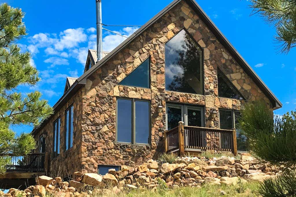Escape to Peak View Vista, a secluded 3-bedroom mountain cabin in Florissant, Colorado. Perched on five private acres, this retreat offers breathtaking 360-degree views of Pikes Peak and stunning sunrise vistas. Perfect for families, our home features an inviting family room, a fun-filled kids room, and a wet bar. Located minutes from the Florissant Fossil Beds and Eleven Mile State Park, it is the ultimate base for fly fishing, hiking, and exploring the Colorado Wolf and Wildlife Center in total comfort.