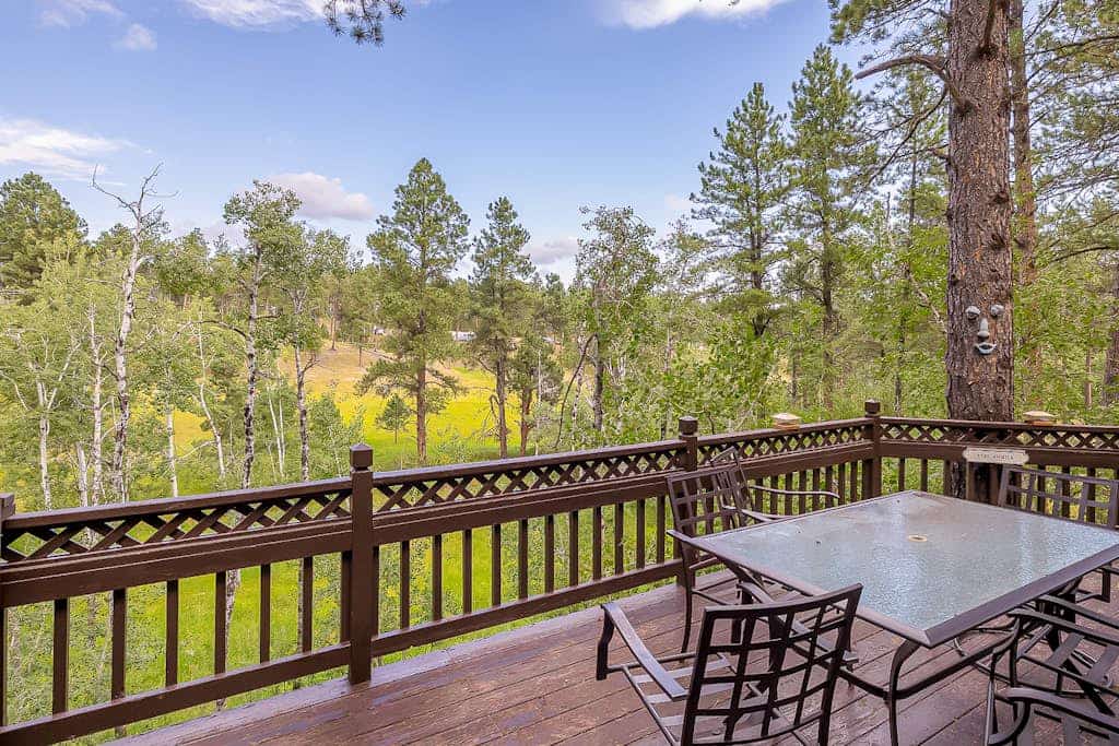 Escape to Big Steve Timbers, a sunlit three bedroom retreat near Rapid City perfectly situated for your Black Hills adventure. This cozy mountain home features a warm fireplace, a well equipped kitchen, and a spacious balcony with stunning views. Enjoy family fun with board games and ping pong, or explore nearby hiking trails, Pactola Lake, and Mount Rushmore. Whether you are seeking a peaceful forest getaway or an action packed basecamp for exploring South Dakota, our home offers the ideal mountain escape.