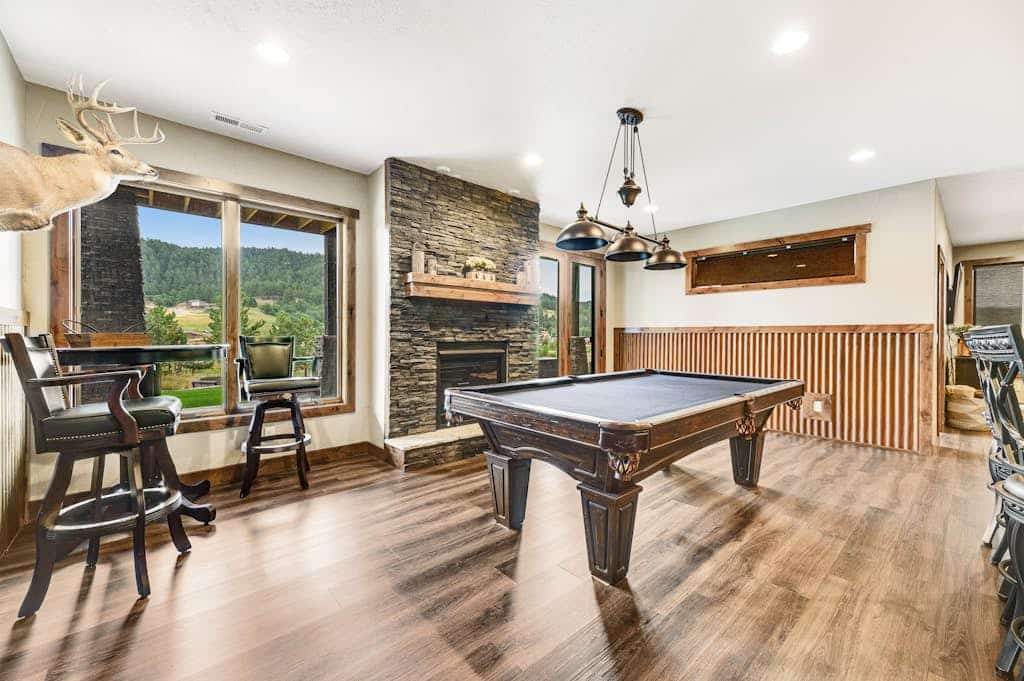 Come enjoy the perfect Black Hills escape at Cedar Lodge on 17. This custom four bedroom home sits right on the Boulder Canyon golf course with amazing views of the pond and island green. You can kick back in your private hot tub, play some pool, or hang out by the custom firepits after a long day of exploring. We are just minutes away from historic Deadwood and Sturgis, making this the best spot to stay while you visit Mount Rushmore, Crazy Horse, and the local trails. Your relaxing mountain getaway is ready for you.