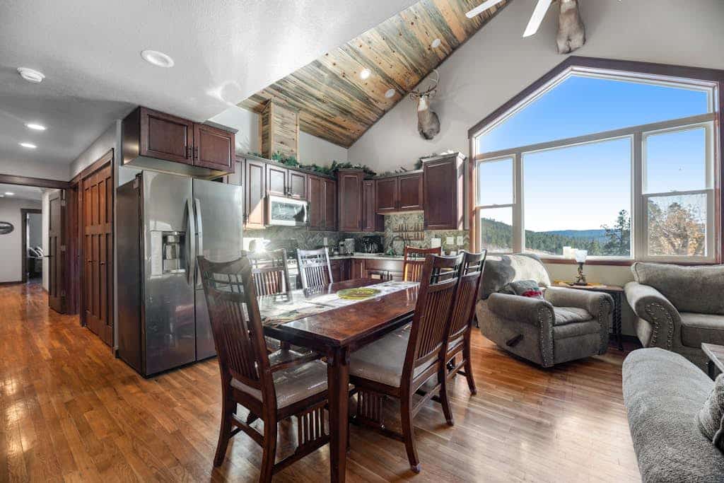 Escape to Whitegate Lodge, a stunning 6-bedroom retreat nestled in the Black Hills near Nemo. Perfect for large groups, this fully remodeled home features two kitchens, private loft spaces, and a relaxing hot tub. Enjoy valley views from the expansive deck, complete with a gas firepit and grill. Ideally located for outdoor adventures, you are just minutes from hiking trails and Dalton Lake. Experience the perfect blend of secluded mountain charm and modern comfort near Rapid City and Sturgis.