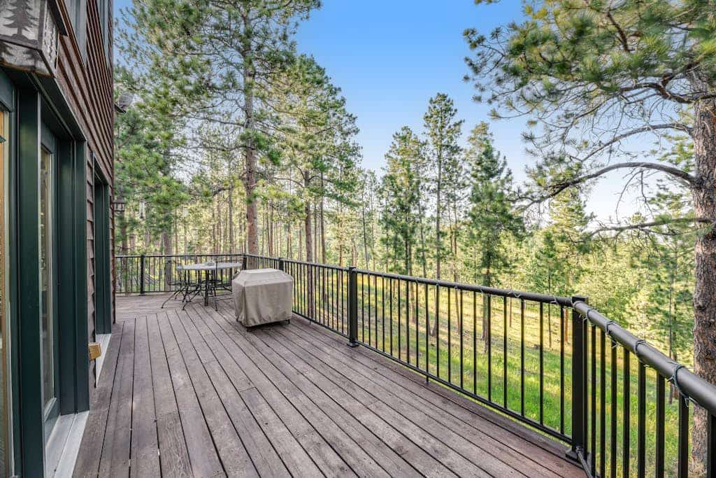Experience the ultimate Black Hills getaway at Boulder Canyon Lodge, a spacious 5-bedroom cabin just minutes from historic Deadwood. Perfect for groups, this retreat features a custom game room with a pool table and retro gaming, and easy access for trailers and RVs. Whether you are here for skiing at Terry Peak, biking the Mickelson Trail, or enjoying the Sturgis Rally, our lodge offers the perfect blend of luxury and adventure in a stunning mountain setting for your next family escape.