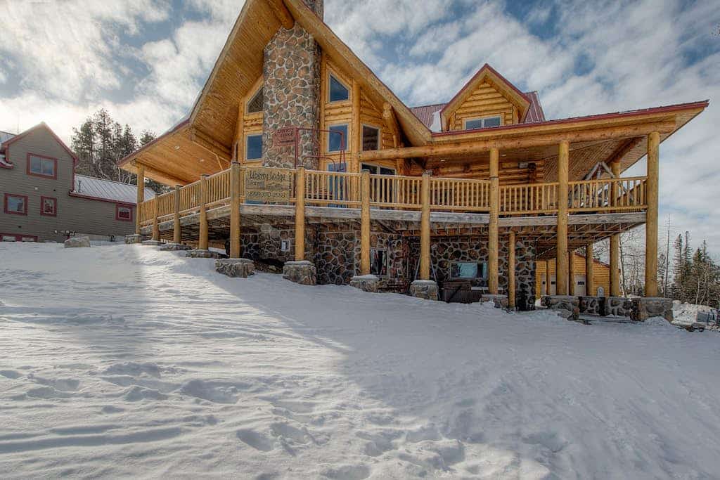 Experience the ultimate mountain getaway at Liberty Lodge, a premier 6-bedroom ski-in/ski-out retreat at Terry Peak. Perfect for large groups and families, this spacious home offers private hot tub relaxation, dual fireplaces, and a dedicated game room. Enjoy seamless access to world-class skiing and the charming attractions of nearby Lead and Deadwood. With an expansive deck and modern amenities, it is the perfect year-round basecamp for your Black Hills adventure.