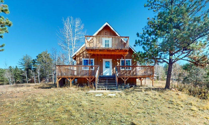 Escape to Pine Perch, a charming A-frame retreat nestled in the heart of Florissant. This cozy two-bedroom home offers the perfect mountain getaway, featuring a warm wood stove, a fully equipped kitchen, and a peaceful balcony for stargazing. Ideally located near Pikes Peak attractions, including the Colorado Wolf and Wildlife Center and scenic mountain trails, this family-friendly sanctuary provides everything you need for a restful nature retreat. Enjoy modern comforts in a serene, tree-lined setting.