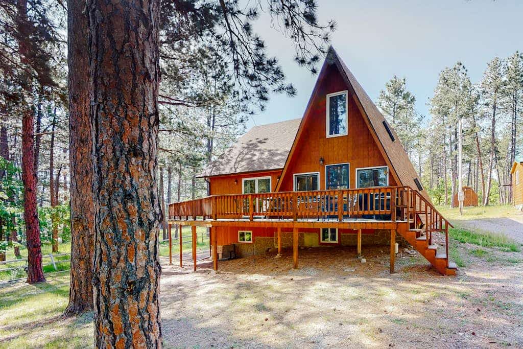 Discover your perfect Black Hills getaway at this charming mountain home located just seven miles from Sturgis. This serene retreat features a main house and a private detached cabin, offering ample space for the whole family. Enjoy stunning mountain views from the wrap-around deck, modern amenities like a full kitchen, and easy access to Boulder Canyon Golf Club. Ideally situated near Deadwood and Mount Rushmore, our home provides the ultimate peaceful base for your next outdoor adventure or group vacation.