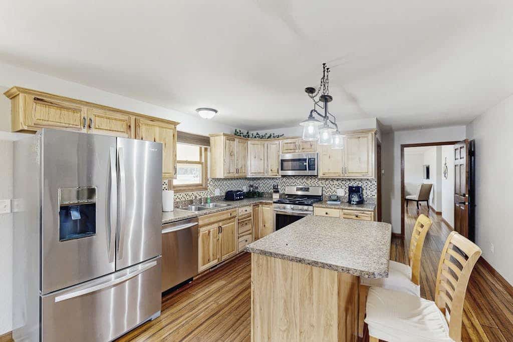 Experience the ultimate Black Hills retreat at Stratobowl Escape, a flexible dual unit home perfect for families and groups. Located just steps from the Stratobowl Rim Trailhead, this property offers a peaceful rural setting with easy access to Mount Rushmore and Custer State Park. Enjoy two fully equipped kitchens, cozy living areas, and a private fenced backyard with a fire pit and grill. Whether you are seeking adventure or relaxation in our large jetted tub, this is your ideal basecamp near Rapid City.