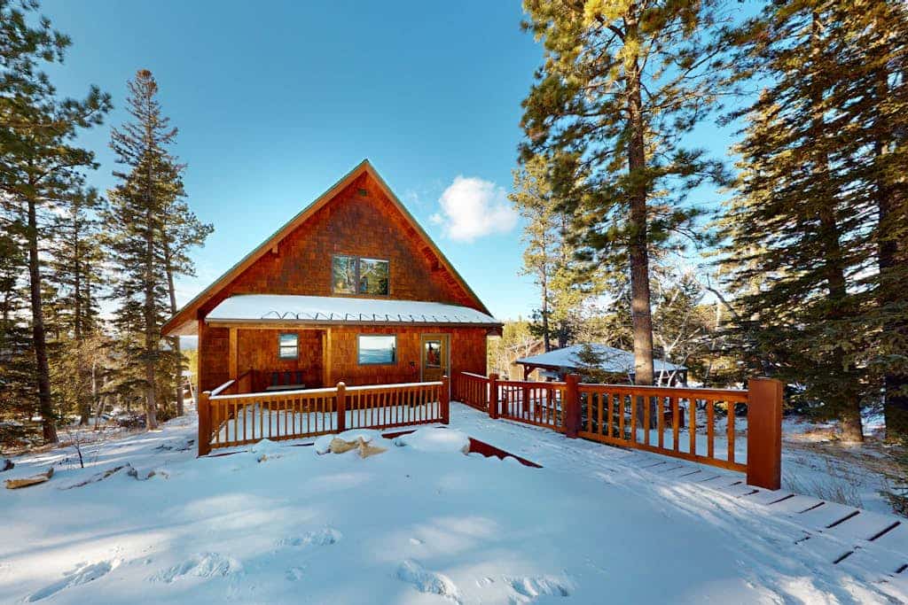 Escape to Buffalo Lodge, a stunning three-story cabin in the Black Hills near Lead, South Dakota. Perfect for families, this spacious retreat features four decks with breathtaking mountain views and a private hot tub for ultimate relaxation. Enjoy a cozy fireplace, a fun-filled game room, and a modern kitchen. Ideally located minutes from Terry Peak Ski Area and close to Deadwood, this cabin offers year-round adventure, from winter skiing to summer hiking and fishing. Your perfect mountain getaway starts here.