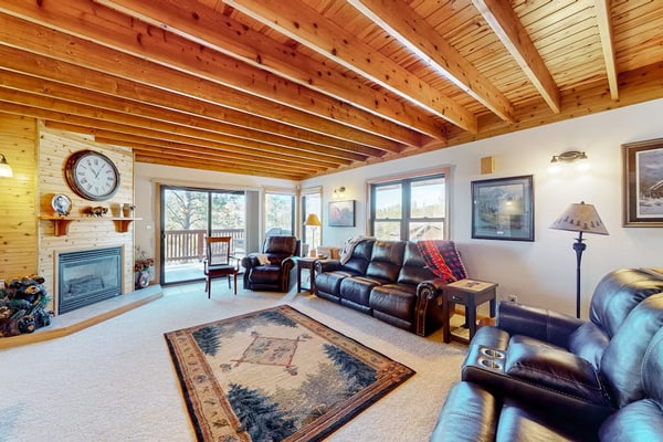 Escape to Buffalo Lodge, a stunning three-story cabin in the Black Hills near Lead, South Dakota. Perfect for families, this spacious retreat features four decks with breathtaking mountain views and a private hot tub for ultimate relaxation. Enjoy a cozy fireplace, a fun-filled game room, and a modern kitchen. Ideally located minutes from Terry Peak Ski Area and close to Deadwood, this cabin offers year-round adventure, from winter skiing to summer hiking and fishing. Your perfect mountain getaway starts here.