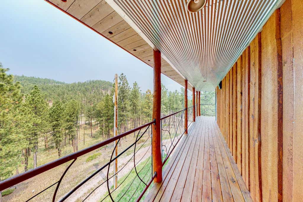 Experience the perfect blend of rustic charm and modern luxury at this custom 3 bedroom cabin in the Black Hills. Located just a mile from Hill City, this secluded retreat offers breathtaking 360 degree mountain views from a private wraparound deck. Enjoy a spacious chef kitchen, plush living areas, and a primary suite with a deep soaking tub. Perfectly positioned as your central base for Mount Rushmore, Crazy Horse, and the 1880 Train, it is an ideal escape for families seeking comfort and adventure.