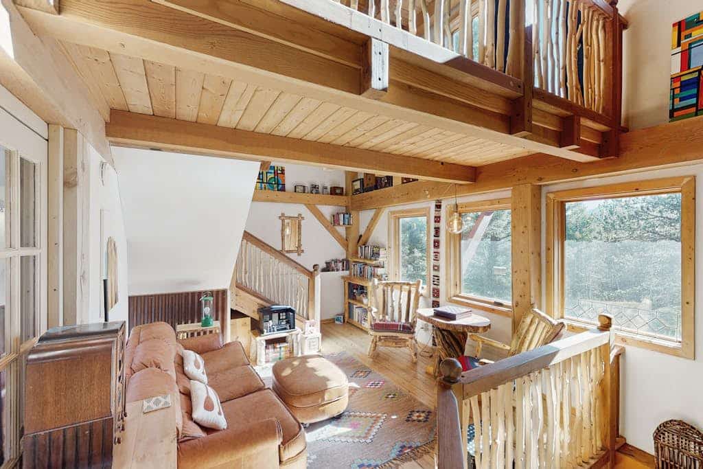 Experience the ultimate mountain getaway at this charming 2-bedroom timberframe treehouse in Florissant. Perfectly positioned with breathtaking views of Pikes Peak, this retreat offers a serene escape with modern amenities including a fully equipped kitchen and a private hot tub. Enjoy world-class stargazing near the Florissant Fossil Beds or visit the nearby Colorado Wolf and Wildlife Center. Whether you are seeking adventure or relaxation, this family-friendly home provides the perfect base for your Colorado vacation.