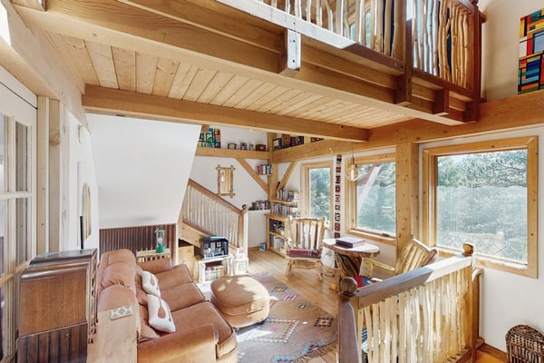 Experience the ultimate mountain getaway at this charming 2-bedroom timberframe treehouse in Florissant. Perfectly positioned with breathtaking views of Pikes Peak, this retreat offers a serene escape with modern amenities including a fully equipped kitchen and a private hot tub. Enjoy world-class stargazing near the Florissant Fossil Beds or visit the nearby Colorado Wolf and Wildlife Center. Whether you are seeking adventure or relaxation, this family-friendly home provides the perfect base for your Colorado vacation.