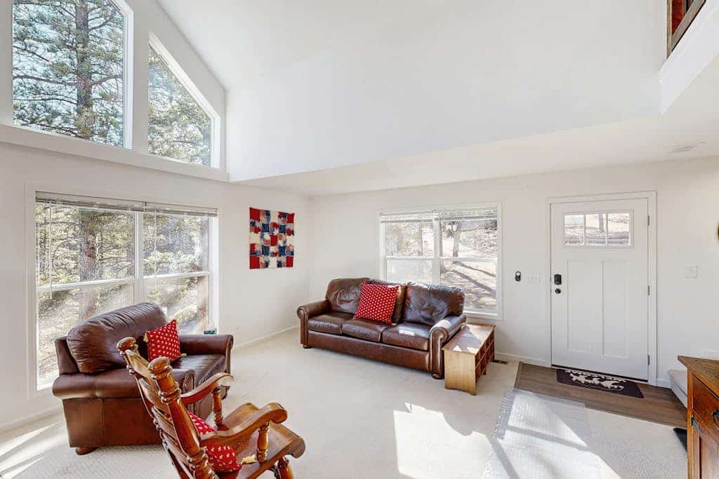 Escape to Crystal View, a charming 3-bedroom cabin in Florissant, Colorado, offering the ultimate mountain retreat. Relax on the expansive deck with stunning valley views or enjoy indoor fun with a foosball table, private gym, and cozy living area. Perfectly situated near the Florissant Fossil Beds, fishing spots, and scenic Pikes Peak trails, this secluded getaway provides comfort and adventure for the whole family. Experience serene nature and modern amenities in this peaceful woodland home.