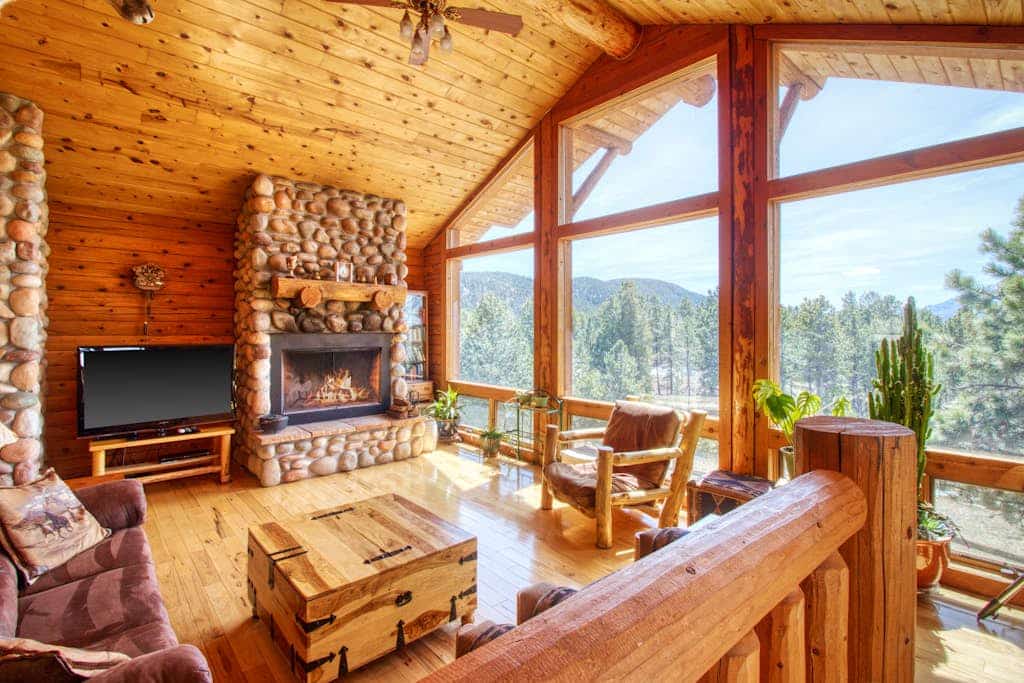 Escape to Mills Ranch, a breathtaking log cabin set on 10 private acres in Woodland Park. Enjoy spectacular views of Pikes Peak from your private hot tub or gather by the cozy wood burning fireplace. This spacious retreat features three bedrooms, a game room with a pool table, and a chef kitchen. Perfectly situated for outdoor adventures, this mountain getaway offers the ultimate Colorado experience for families and groups seeking comfort, privacy, and proximity to scenic hiking and regional attractions.