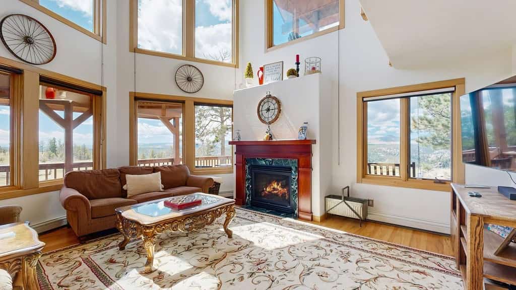 Escape to Skyline Ridge, a stunning 3-bedroom mountain retreat in Florissant. This secluded home features floor-to-ceiling windows with breathtaking views, a cozy fireplace, and a fully equipped kitchen. Enjoy outdoor living with a spacious yard and grill, or explore nearby Pikes Peak and Florissant Fossil Beds. With high-speed internet, a game room, and kid-friendly amenities, this peaceful oasis is the perfect basecamp for family adventures, gold mine tours, and scenic hikes just forty miles from Colorado Springs.