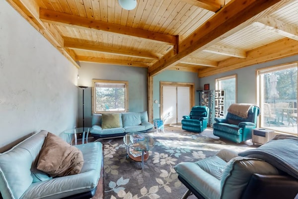 Experience rustic charm at this three-story mountain retreat in Woodland Park. Perfect for families and pets, this home features a fully equipped kitchen, cozy living areas, and two spacious decks for outdoor dining with scenic views. Enjoy a peaceful escape just minutes from local shops, coffee houses, and the Golden Meadows Dog Park. With easy access to Pikes Peak and Colorado Springs, this getaway offers the ideal base for hiking, fishing, and exploring the beauty of the Colorado mountains.