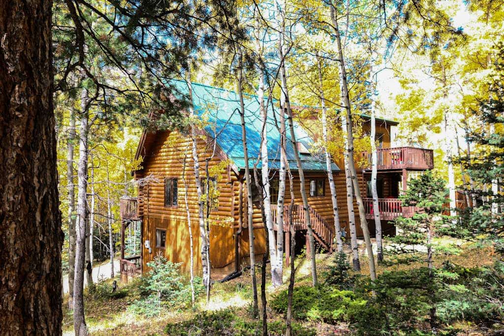 Escape to Pikes Peak Retreat, a stunning 3-bedroom log cabin nestled in a serene aspen grove near Divide, Colorado. Perfectly situated for outdoor enthusiasts, this light-filled getaway offers direct access to National Forest trails, mountain climbing, and fishing. Enjoy cozy evenings by the wood-burning fireplace, relax on the furnished decks, or stargaze by the firepit. With modern amenities, a spacious loft, and proximity to Mueller State Park, it is the ultimate mountain basecamp for your family adventure.