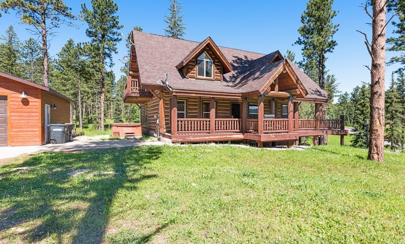 Escape to Boulder Ridge Lodge, a stunning 5-bedroom log cabin located in the heart of the Black Hills near Lead. This spacious retreat offers the perfect blend of luxury and comfort, featuring a private hot tub, soaring vaulted ceilings, and custom rock fireplaces. Designed for groups and families, the lodge includes a fully equipped kitchen and pet-friendly accommodations. Whether you are hitting the links at the adjacent Lead Country Club, exploring the Mickelson Trail, or skiing at Terry Peak, our lodge serves as the ultimate year-round basecamp for your South Dakota adventure.